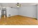 Open living room featuring neutral walls and hardwood flooring at 1902 Elaine Dr, Clearwater, FL 33760