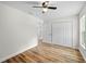 Bedroom featuring hardwood style floors, closet, and natural light at 19275 Wildwood Dr, Brooksville, FL 34601