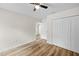 This bedroom includes laminate floors and a closet at 19275 Wildwood Dr, Brooksville, FL 34601