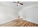 Bedroom with hardwood style floors, closet, and natural light at 19275 Wildwood Dr, Brooksville, FL 34601