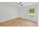 Bedroom featuring a window and hardwood style floors with natural light at 19275 Wildwood Dr, Brooksville, FL 34601