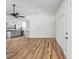 Spacious living room with new floors, open layout to kitchen, and bright, neutral paint at 19275 Wildwood Dr, Brooksville, FL 34601