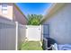 Practical backyard area with a white fence and storage units at 19555 Timberbluff Dr, Land O Lakes, FL 34638