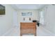 Bedroom with tray ceiling, tiled floors, ample natural light, and a comfortable bed at 19555 Timberbluff Dr, Land O Lakes, FL 34638