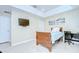 Bright bedroom featuring tiled floor, work space, light blue comforter, and recessed lighting at 19555 Timberbluff Dr, Land O Lakes, FL 34638