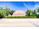 Beautiful community entrance sign 'Tierra del Sol' with manicured landscaping and paved road at 19555 Timberbluff Dr, Land O Lakes, FL 34638