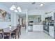 Bright kitchen with stainless steel appliances, granite countertops, and open floor plan at 19555 Timberbluff Dr, Land O Lakes, FL 34638