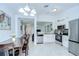 Bright kitchen with stainless steel appliances, granite countertops, and tile flooring at 19555 Timberbluff Dr, Land O Lakes, FL 34638