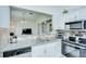 Kitchen featuring stainless steel appliances, granite countertops, and open breakfast bar at 19555 Timberbluff Dr, Land O Lakes, FL 34638