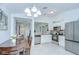 Well-lit kitchen featuring stainless steel appliances, granite countertops, and tile flooring at 19555 Timberbluff Dr, Land O Lakes, FL 34638
