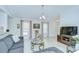 Cozy living area with a modern sofa, media center, and neutral decor, creating a comfortable atmosphere at 19555 Timberbluff Dr, Land O Lakes, FL 34638