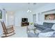 Bright living room with vaulted ceilings, neutral walls, stylish furnishings, and tile flooring at 19555 Timberbluff Dr, Land O Lakes, FL 34638