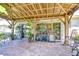 Spacious outdoor patio featuring a grill, dining furniture, and ample space for relaxing and entertaining at 19555 Timberbluff Dr, Land O Lakes, FL 34638