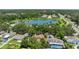 Aerial view showcasing the property, nearby lake, and surrounding community at 2068 Diane Ave, Palm Harbor, FL 34683