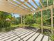 Relaxing backyard featuring a cozy patio and garden, ideal for outdoor enjoyment at 2068 Diane Ave, Palm Harbor, FL 34683
