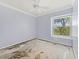 Bedroom featuring a ceiling fan and a window with a neighborhood view at 2068 Diane Ave, Palm Harbor, FL 34683