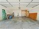 A spacious garage with shelving, peg boards, and ample storage space at 2068 Diane Ave, Palm Harbor, FL 34683