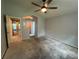 Main bedroom featuring neutral paint, an ensuite bathroom, and a walk-in closet for convenience and style at 2068 Diane Ave, Palm Harbor, FL 34683
