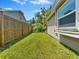 A fenced side yard offers privacy and space at 2068 Diane Ave, Palm Harbor, FL 34683