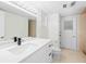 Bright bathroom featuring a modern vanity with quartz countertop and stylish fixtures at 2141 Coachman Rd, Spring Hill, FL 34608