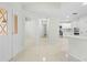 Inviting entryway with tile flooring leads into the kitchen area of the house at 2141 Coachman Rd, Spring Hill, FL 34608