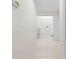 Laundry room featuring a utility sink and ample shelving for storage at 2141 Coachman Rd, Spring Hill, FL 34608