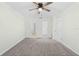 Spacious main bedroom with dual entry points to the bathroom at 2141 Coachman Rd, Spring Hill, FL 34608