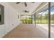 Screened in patio with ceiling fans overlooking backyard at 2141 Coachman Rd, Spring Hill, FL 34608