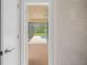 View of pool area from inside of home at 2141 Coachman Rd, Spring Hill, FL 34608