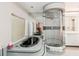 Luxurious bathroom featuring a modern standalone shower, soaking tub, and sleek countertops at 2199 Blue Tern Dr, Palm Harbor, FL 34683
