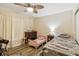 This charming bedroom has a ceiling fan, nice wood floors, and two different beds for a flexible setup at 2199 Blue Tern Dr, Palm Harbor, FL 34683