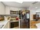 Modern kitchen with stainless steel appliances, sleek countertops, and ample cabinet space at 2199 Blue Tern Dr, Palm Harbor, FL 34683