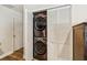 This convenient laundry area features a modern, stacked washer and dryer unit in a closet at 2199 Blue Tern Dr, Palm Harbor, FL 34683