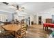 Spacious open-concept living area with hardwood floors connecting kitchen and dining spaces at 2199 Blue Tern Dr, Palm Harbor, FL 34683