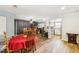 Spacious open-concept living area with hardwood floors connecting kitchen and dining spaces at 2199 Blue Tern Dr, Palm Harbor, FL 34683