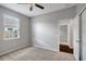Comfortable bedroom with carpet floors and a window providing natural light at 22824 Marsh Wren Dr, Land O Lakes, FL 34639