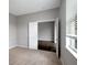 Bright bedroom showcases carpet flooring with open doorway to another room at 22824 Marsh Wren Dr, Land O Lakes, FL 34639