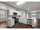 Bright kitchen with stainless steel appliances, white cabinetry, and a modern design at 22824 Marsh Wren Dr, Land O Lakes, FL 34639