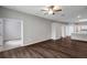 Open concept living room featuring wood-look flooring and neutral paint at 22824 Marsh Wren Dr, Land O Lakes, FL 34639