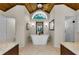 Charming bathroom featuring a soaking tub, granite counters, and wood ceiling at 2455 Anthony Ave, Clearwater, FL 33759