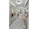 Hallway view of a primary bathroom with a luxurious soaking tub at 2455 Anthony Ave, Clearwater, FL 33759