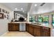 A lovely open concept kitchen shows a stainless steel dishwasher and granite counters at 2455 Anthony Ave, Clearwater, FL 33759