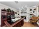 Home office features built-in bookshelves, a fireplace, and a large desk at 2455 Anthony Ave, Clearwater, FL 33759