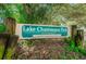 Sign for Lake Chautauqua Park, in Clearwater, located among green plants and shady trees at 2455 Anthony Ave, Clearwater, FL 33759