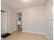 Open dining room with tile flooring, neutral walls, and a view into the updated kitchen at 2926 Fairfield S Ave, St Petersburg, FL 33712