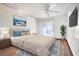 Modern bedroom boasts sleek hardwood floors, light neutral decor, and ample natural light at 3026 Cedaridge Dr, Tampa, FL 33618