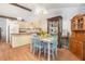 Cozy dining area features a breakfast bar, charming decor, and wood-look flooring at 3026 Cedaridge Dr, Tampa, FL 33618