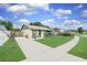 Well-maintained home with a spacious driveway, a green lawn, and appealing landscaping at 3026 Cedaridge Dr, Tampa, FL 33618