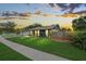 Charming home with a manicured lawn, flower beds, and a welcoming walkway in a serene neighborhood at 3026 Cedaridge Dr, Tampa, FL 33618