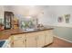 Open kitchen with a view into the dining area, plenty of counter space, and bright natural light at 3026 Cedaridge Dr, Tampa, FL 33618